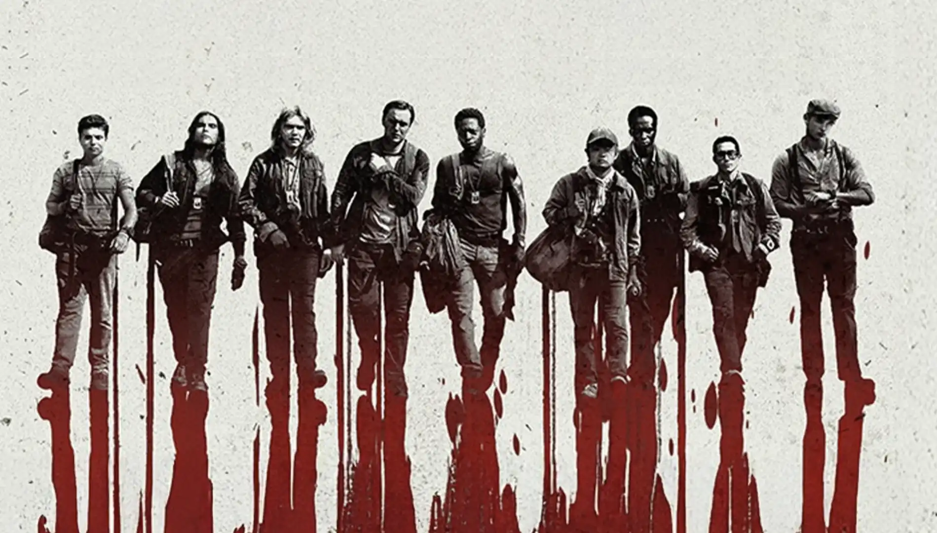 Um grupo de nove pessoas, aparentemente homens, caminhando em linha. Eles estão vestidos com roupas casuais e têm expressões sérias, com sombras alongadas e avermelhadas sob os pés, como se estivessem em uma poça de sangue.