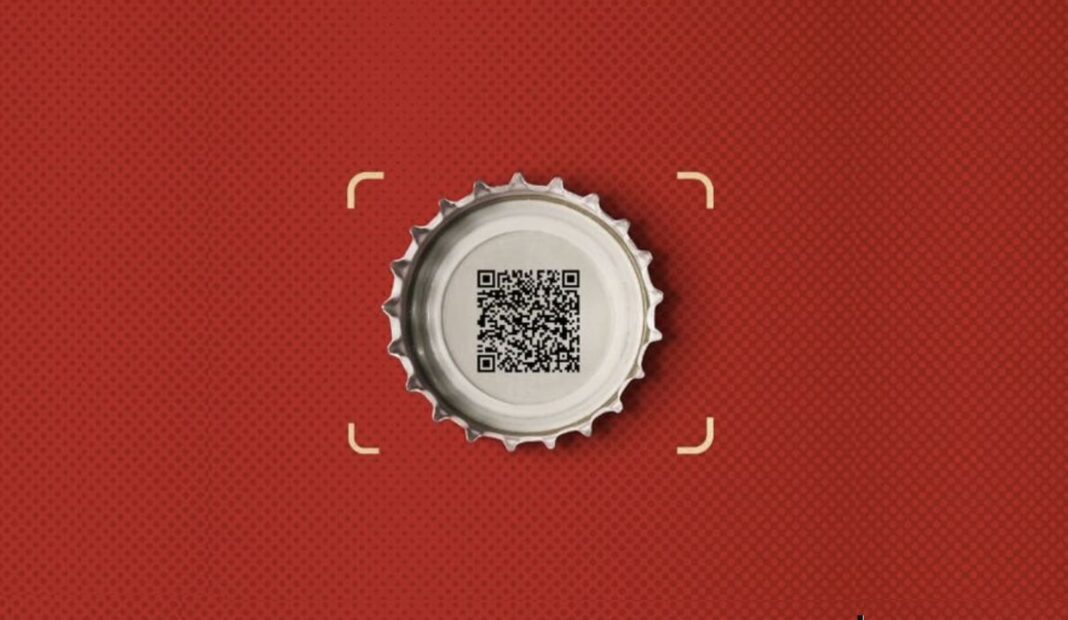 QR code em uma tampa de garrafa, centralizado sobre um fundo vermelho pontilhado.