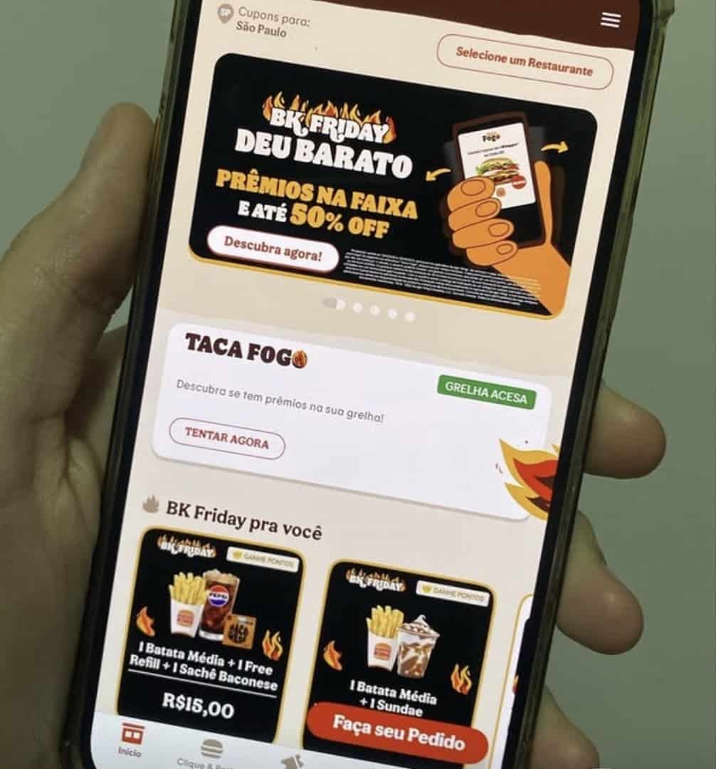 Captura de tela do aplicativo do Burger King no celular, destacando a campanha BK Friday com o jogo/promoção "TACA FOGO" e ofertas de combos como "1 Batata Média + 1 Free Refill + 1 Sachê Baconese" por R$ 15,00.