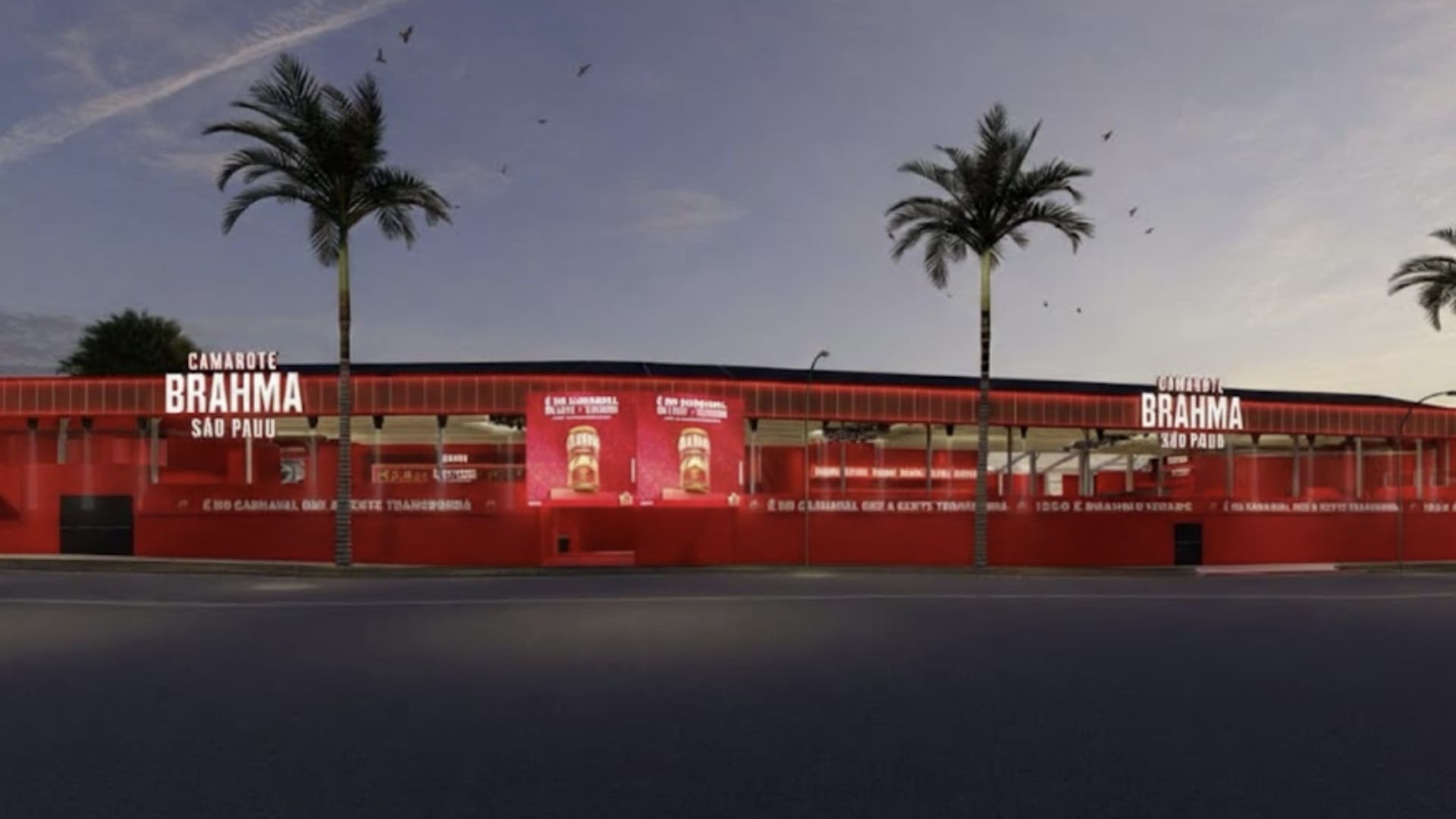 Fachada frontal do Camarote Brahma no Sambódromo de São Paulo durante o entardecer. A estrutura é inteiramente vermelha, com palmeiras nas laterais e o logotipo do evento iluminado em branco.