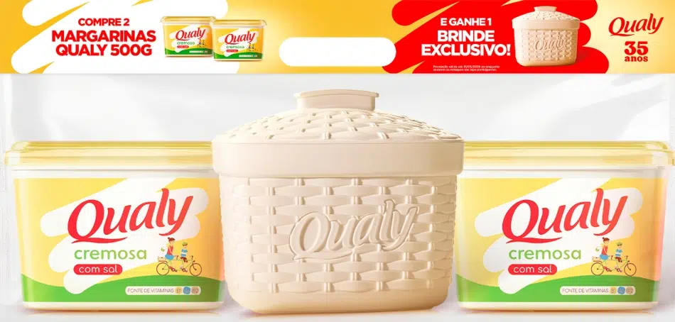 Banner promocional da Qualy mostrando dois potes de margarina de 500g ao lado de um porta-pote retrô na cor creme. No topo, há textos informando que na compra de duas unidades, o consumidor ganha o brinde exclusivo. O logo de 35 anos da marca aparece no canto superior direito.