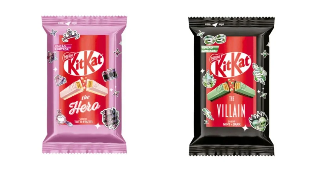 Lado a lado, as embalagens de KitKat "The Hero" e "The Villain". A versão Hero é rosa com sabor Tutti-Frutti e ícones de coroa e brilhos. A versão Villain é preta com sabor Mint + Dark e ícones de cobra e raios.