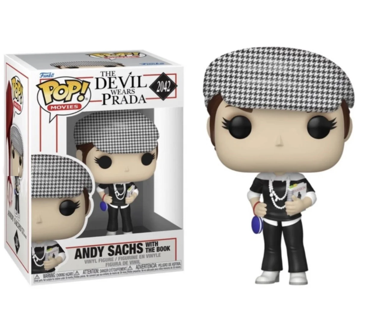 A caixa oficial da Funko Pop! Movies e o boneco de Andy Sachs (número 2042) de O Diabo Veste Prada. A caixa mostra o título do filme e a ilustração do boneco. Andy, fora da caixa, usa sua roupa preta e branca com boina xadrez e segura o 'Livro da Runway'.