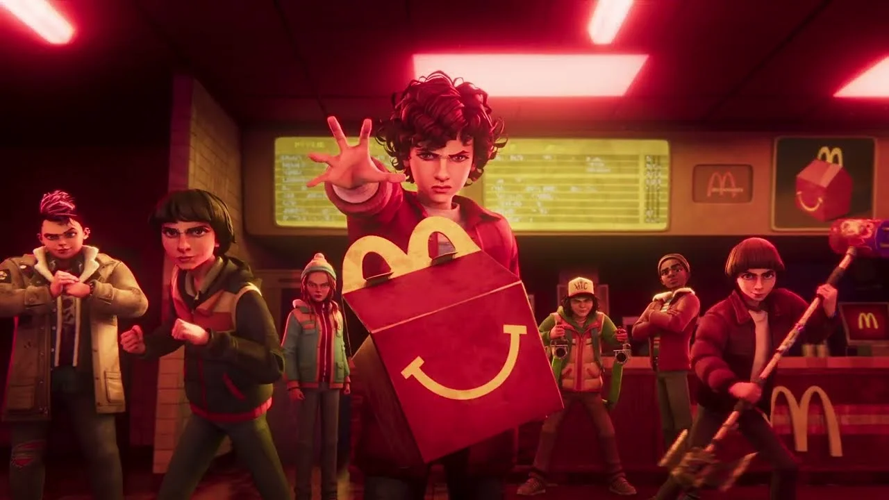 Personagens de Stranger Things em um McDonald's de estilo retrô, sob luzes vermelhas.