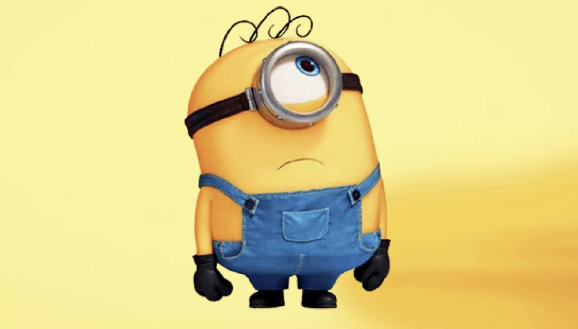 Minion de um olho aparece olhando para cima com expressão confusa em fundo amarelo claro.