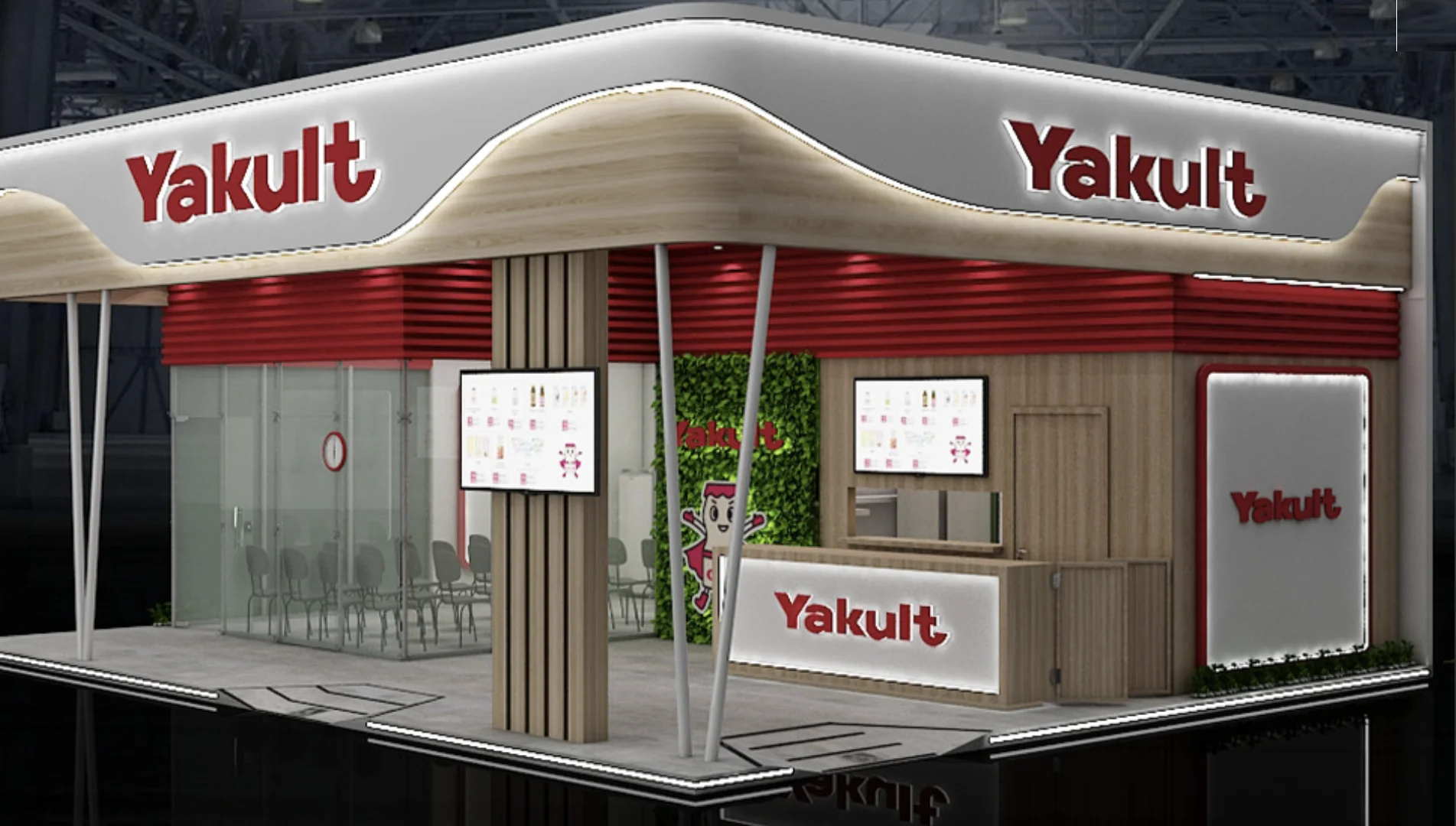 Estande da Yakult montado para o Festival do Japão 2026, com fachada em madeira e vermelho, balcão de atendimento, painéis digitais e espaço para receber visitantes.