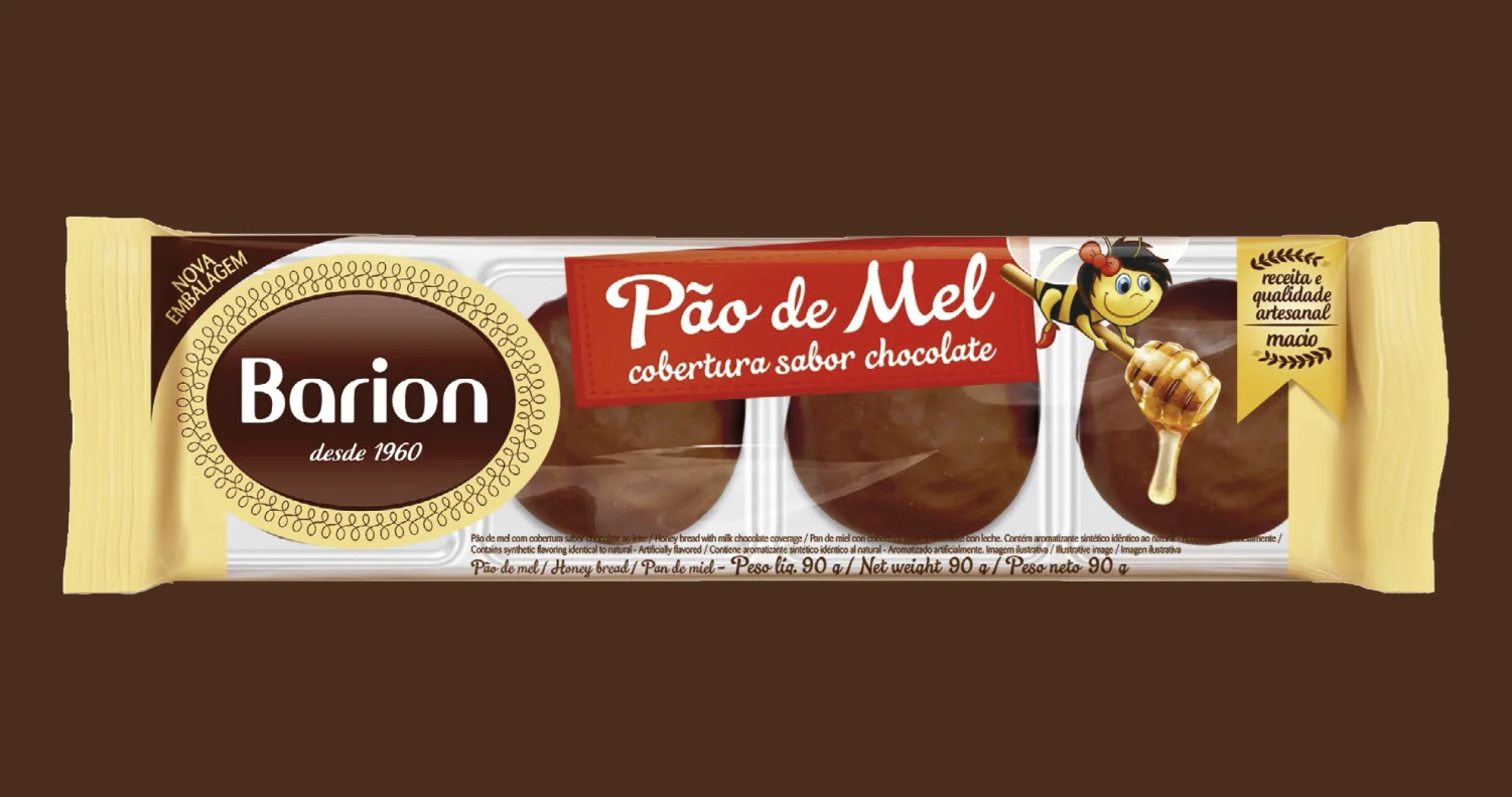 Embalagem do pão de mel Barion sabor chocolate aparece em banner promocional com fundo marrom.