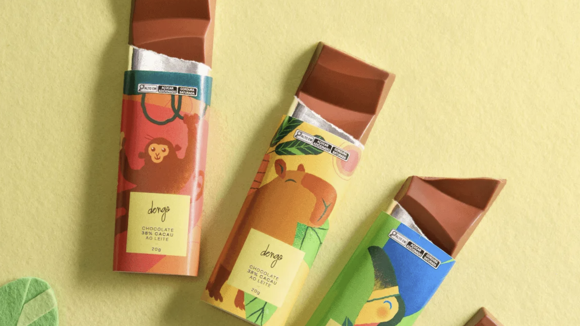Barrinhas de chocolate ao leite Dengo com embalagens infantis ilustradas com animais.